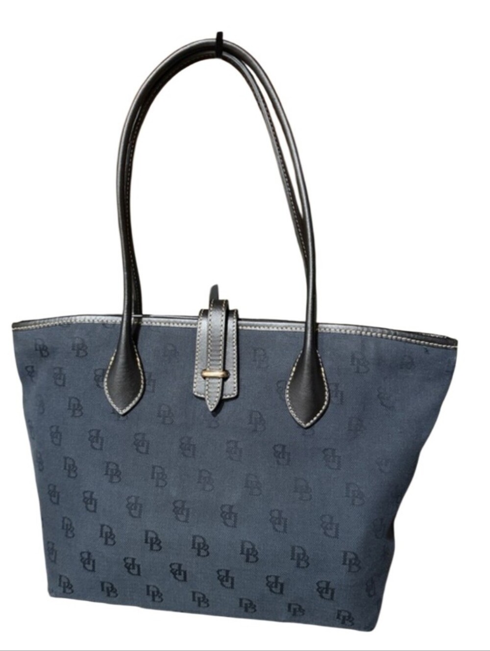 Dooney & Bourke tote bag features a tonal monogram pattern on navy canvas GUC